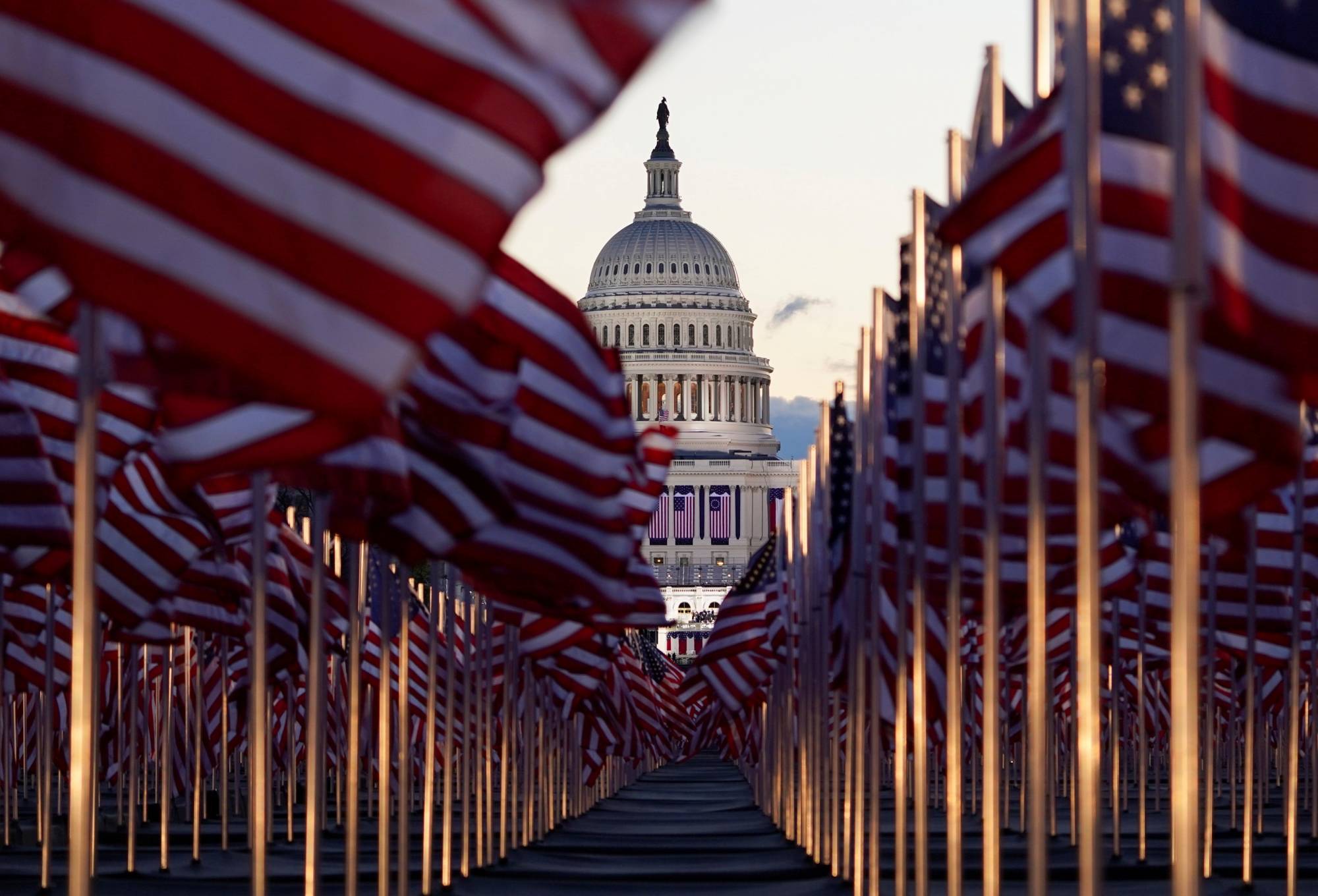 American flags line the National Mall in front of the U.S. Capitol building ahead of inauguration ceremonies for President-elect Joe Biden in Washington on Wednesday. | REUTERS