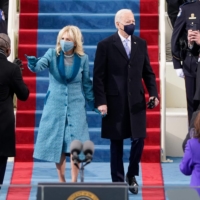 U.S. President-elect Joe Biden flanked by wife Dr. Jill Biden arrives for his inauguration as the 46th U.S. president on Wednesday at the U.S. Capitol in Washington. | AFP-JIJI