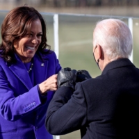 Kamala Harris bumps fists with Joe Biden after being sworn in as vice president of the United States during the inauguration on the West Front of the U.S. Capitol in Washington on Wednesday. | REUTERS