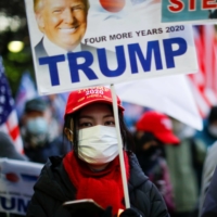 Supporters of U.S. President Donald Trump protest ahead of the inauguration of President-elect Joe Biden, in Tokyo\'s Ginza district on Wednesday.  | REUTERS
