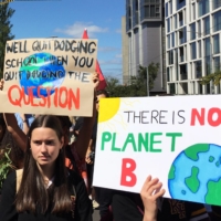 Protesters demanding action on climate change gather in Melbourne in March 2019.  | REUTERS 