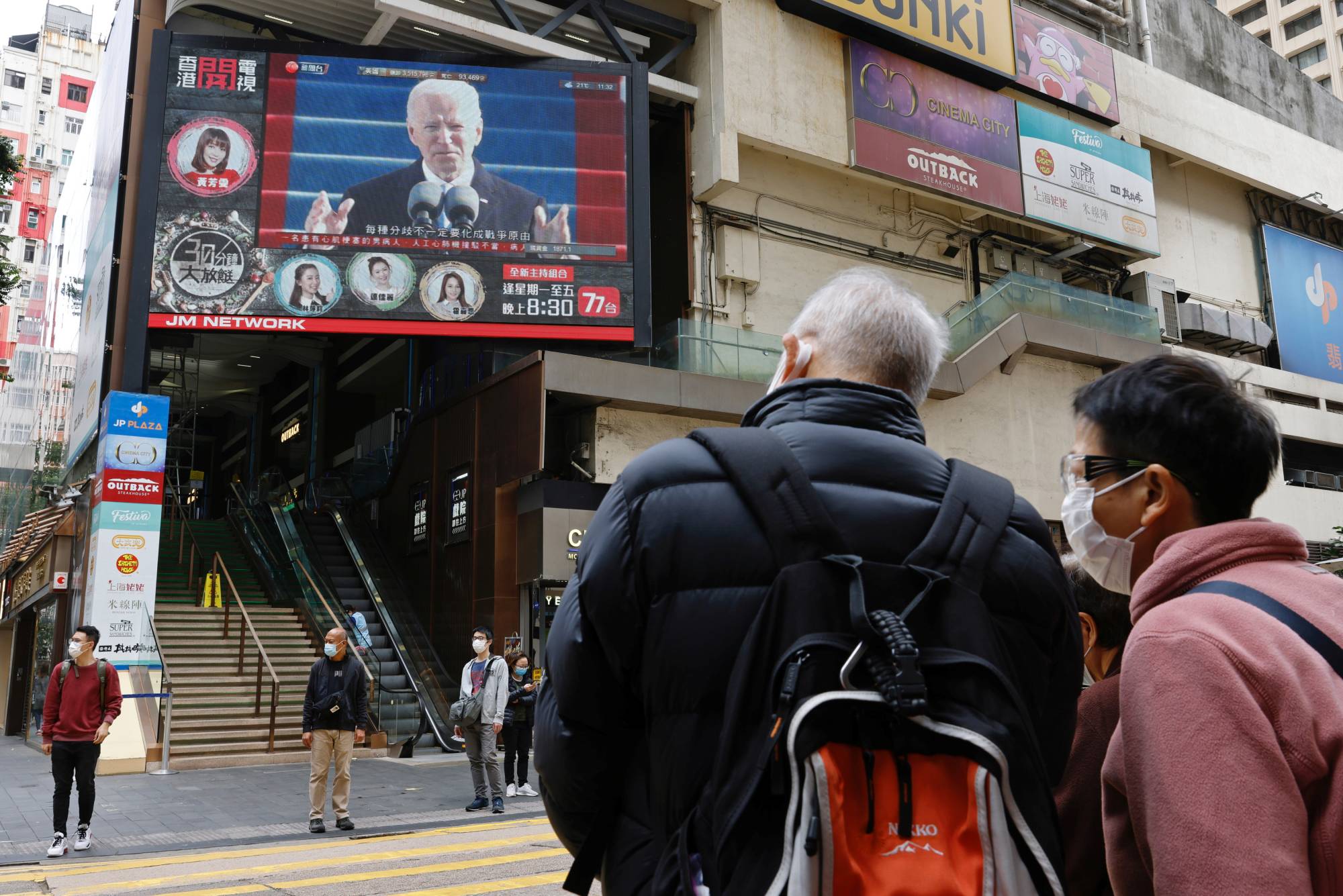 A TV screen in Hong Kong on Thursday shows news of U.S. President Joe Biden's inauguration. | REUTERS