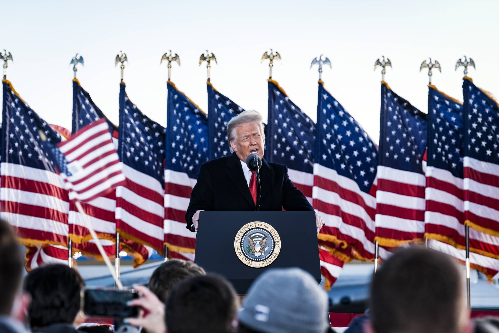 U.S. President Donald Trump speaks to supporters before boarding Air Force One for the last time at Joint Base Andrews in Maryland on Wednesday, hours before the presidential inauguration of Joe Biden. | Pete Marovich / The New York Times