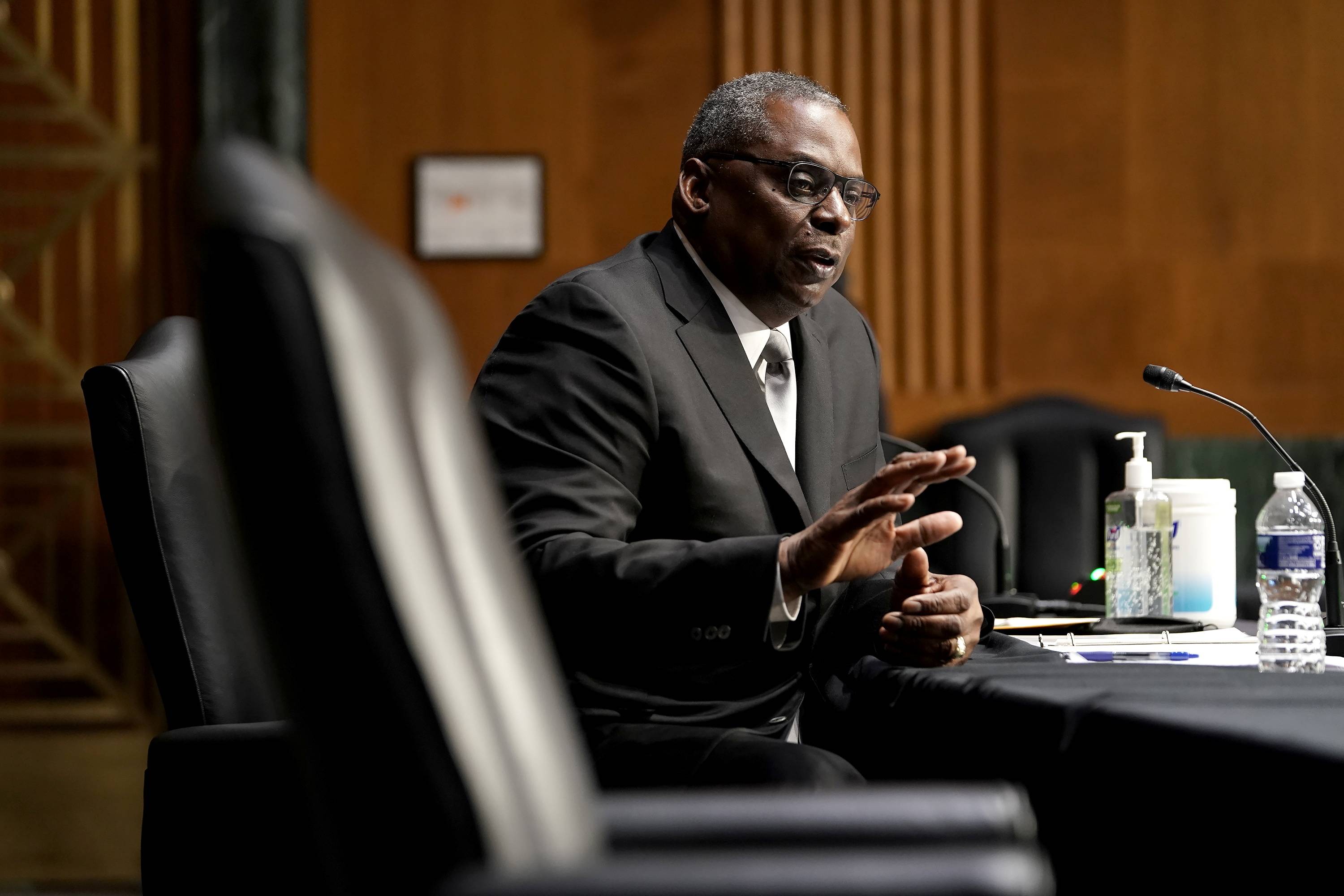 Retired Gen. Lloyd Austin, the Biden's administration's nominee for defense secretary, at confirmation hearings on Capitol Hill in Washington on Tuesday. The House and Senate on Thursday overwhelmingly approved a special waiver that will allow Austin to join Biden's Cabinet. | POOL / VIA THE NEW YORK TIMES