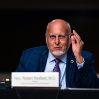 Robert Redfield, then the director of the U.S. Centers for Disease Control and Prevention, spears before a Senate committee in September.  | ANNA MONEYMAKER / THE NEW YORK TIMES