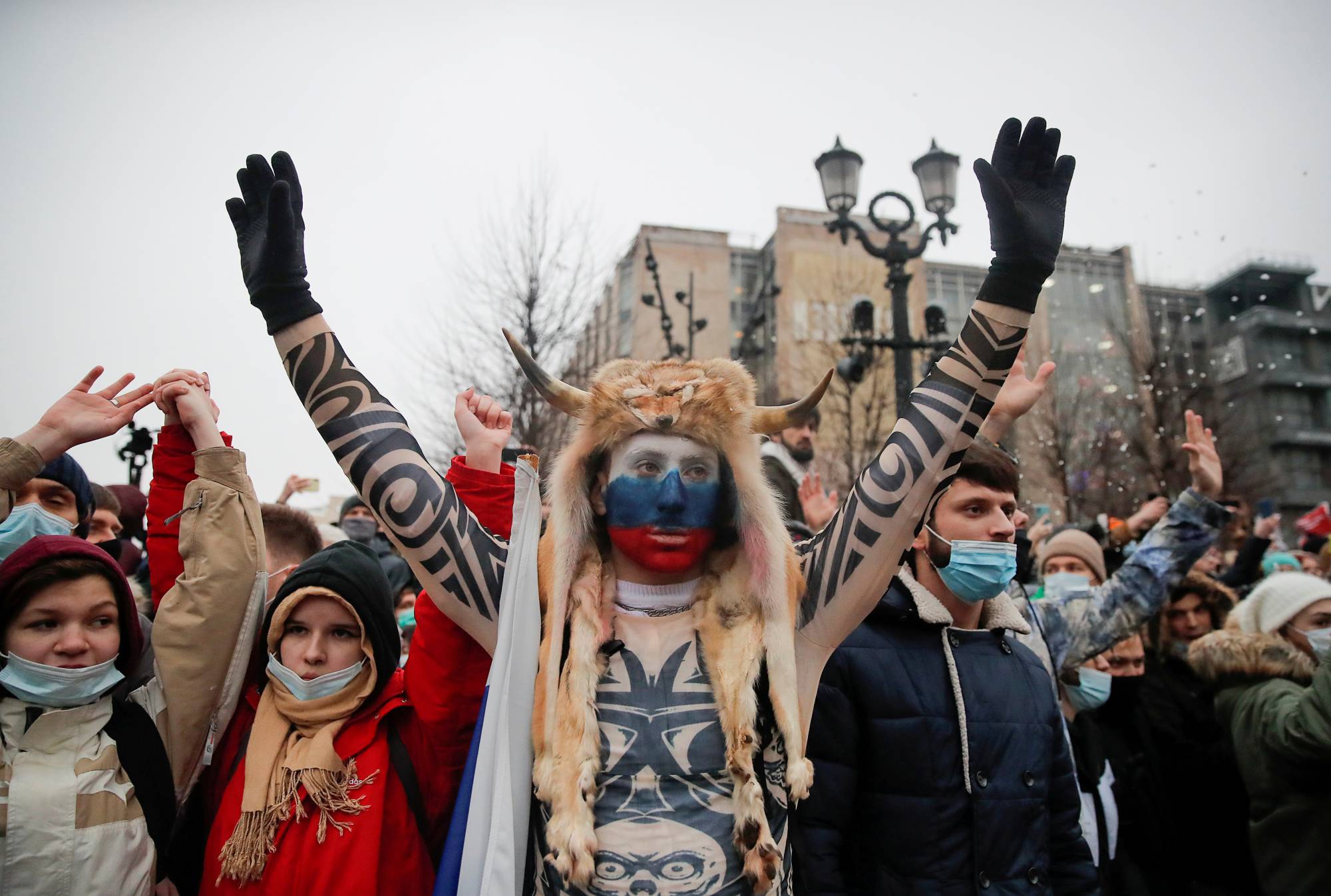 People attend a rally in support of jailed Russian opposition leader Alexei Navalny in Moscow on Saturday.  | REUTERS 