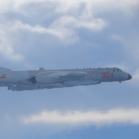 A People\'s Liberation Army H-6K bomber flies on a mission near the median line in the Taiwan Strait, which serves as an unofficial buffer between China and Taiwan, in September.  | TAIWAN DEFENSE MINISTRY / VIA REUTERS