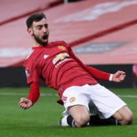 Manchester United\'s Bruno Fernandes celebrates after scoring against Liverpool during their F.A. Cup match in Manchester, England, on Sunday. | REUTERS