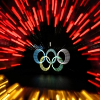 The Olympic rings are lit up at Tokyo\'s Odaiba waterfront on Sunday. | AFP-JIJI