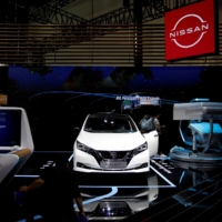 Nissan\'s electric vehicle Leaf is displayed at the Nissan\'s booth at the Beijing International Automotive Exhibition in Beijing in September 2020. | REUTERS