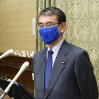 Taro Kono, minister in charge of civil service reform, says Japan has to make child care leave for men more common. | KYODO