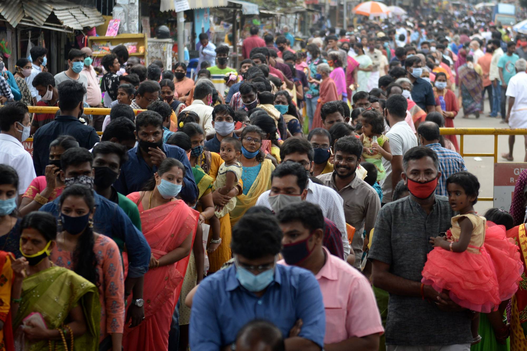 Hindu devotees wait in a queue to enter a Hindu temple on Jan. 1. | AFP-JIJI