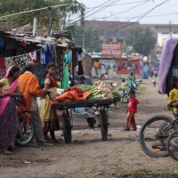 A vegetable vendor stands at the Oriya Basti slum in Bhopal, central India.  | AFP-JIJI