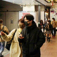 Like their global peers, younger Japanese are increasingly hit with virus fatigue and are not convinced by old politicians\' messages to stay home. | BLOOMBERG