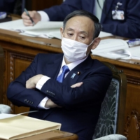 Prime Minister Yoshihide Suga is having a hard time getting his message across to younger people. | BLOOMBERG