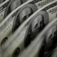 Dollar borrowing costs have dropped in general amid unprecedented monetary stimulus to fight COVID-19, with yield premiums on U.S. currency debt in Asia touching the lowest this month since the pandemic worsened in March. | REUTERS
