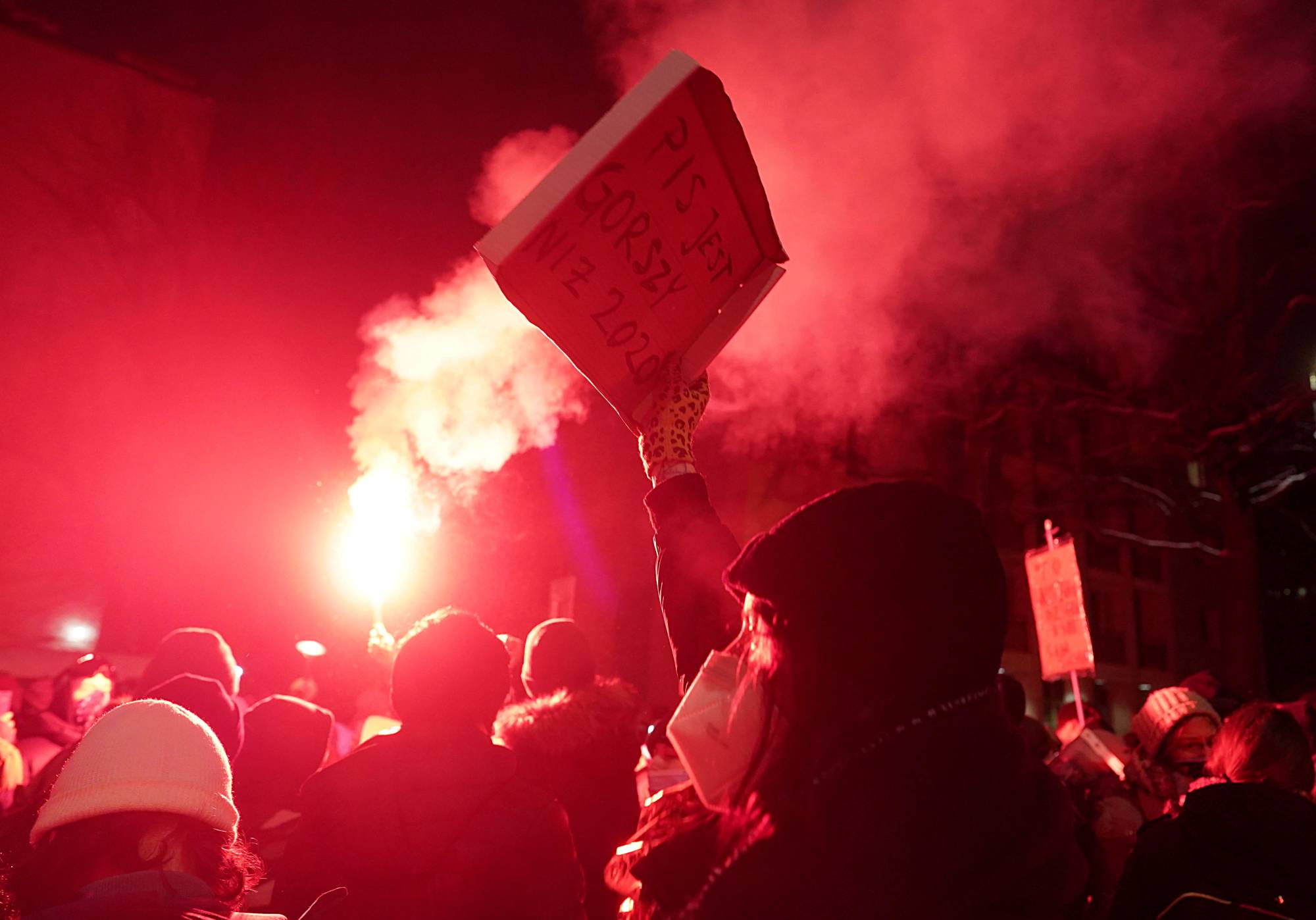 People take part in a protest against the verdict restricting abortion rights, in Warsaw on Thursday. | REUTERS