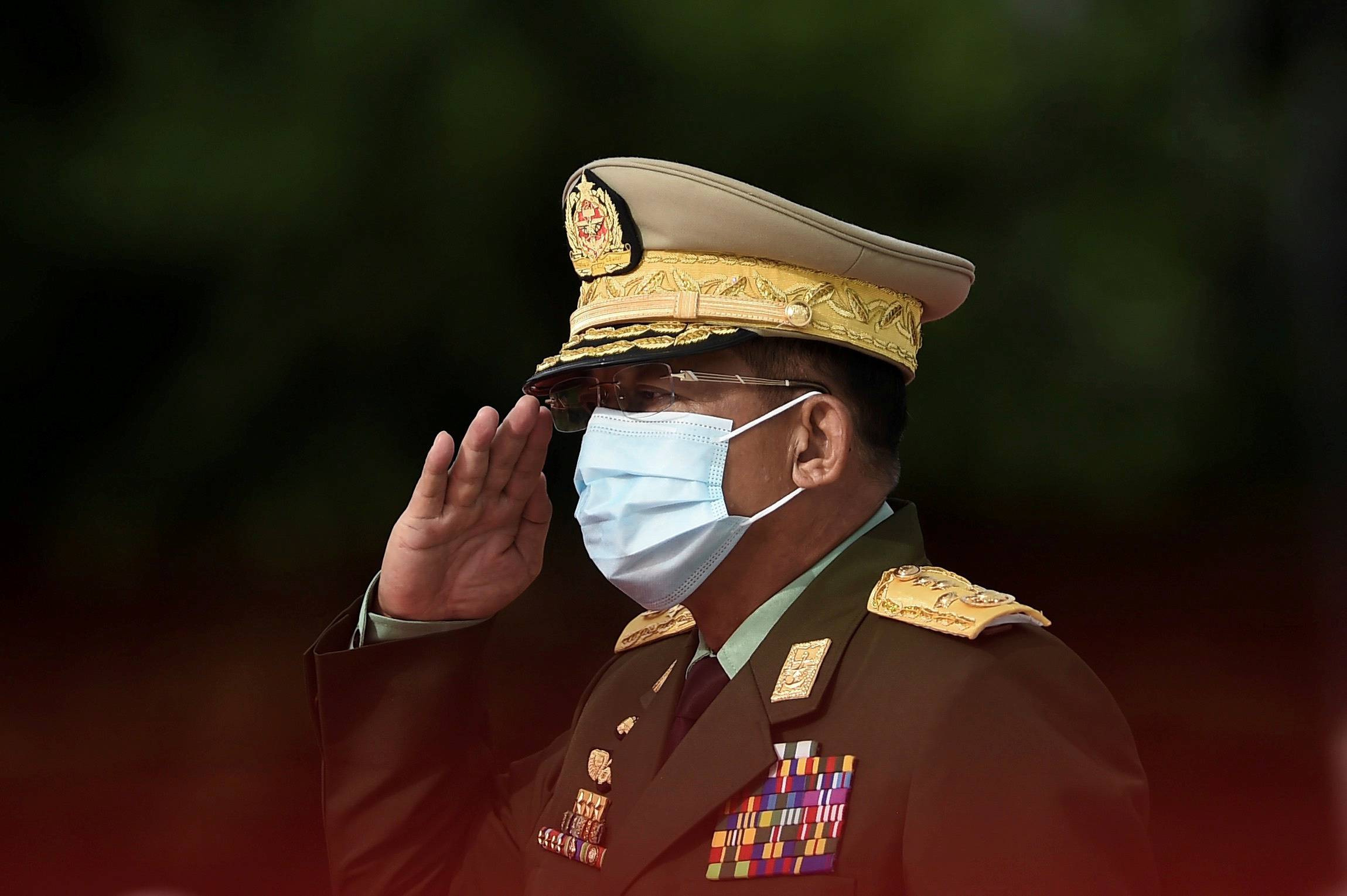 Myanmar's Army Chief Min Aung Hlaing salutes during the Martyrs' Day ceremony in Yangon, Myanmar, on July 19, 2020. | POOL / VIA REUTERS