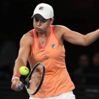 Ash Barty hits a return against Simona Halep during their exhibition match in Adelaide, Australia, on Friday. | AFP-JIJI