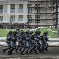 Police in riot gear jog to a position while working to seal off people at a rally in support of jailed Russian opposition leader Alexei Navalny in Moscow on Sunday. Tens of thousands of people who turned out across Russia on Sunday for a second consecutive weekend rally in support of Navalny were met by police in sometimes brutal clashes.  | SERGEY PONOMAREV/THE NEW YORK TIMES