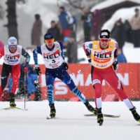 Akito Watabe (left), Ilkka Herola (center) and Jarl Magnus Riiber compete during the 15-km portion of a Nordic combined World Cup event in Seefeld, Austria, on Sunday. | AFP-JIJI