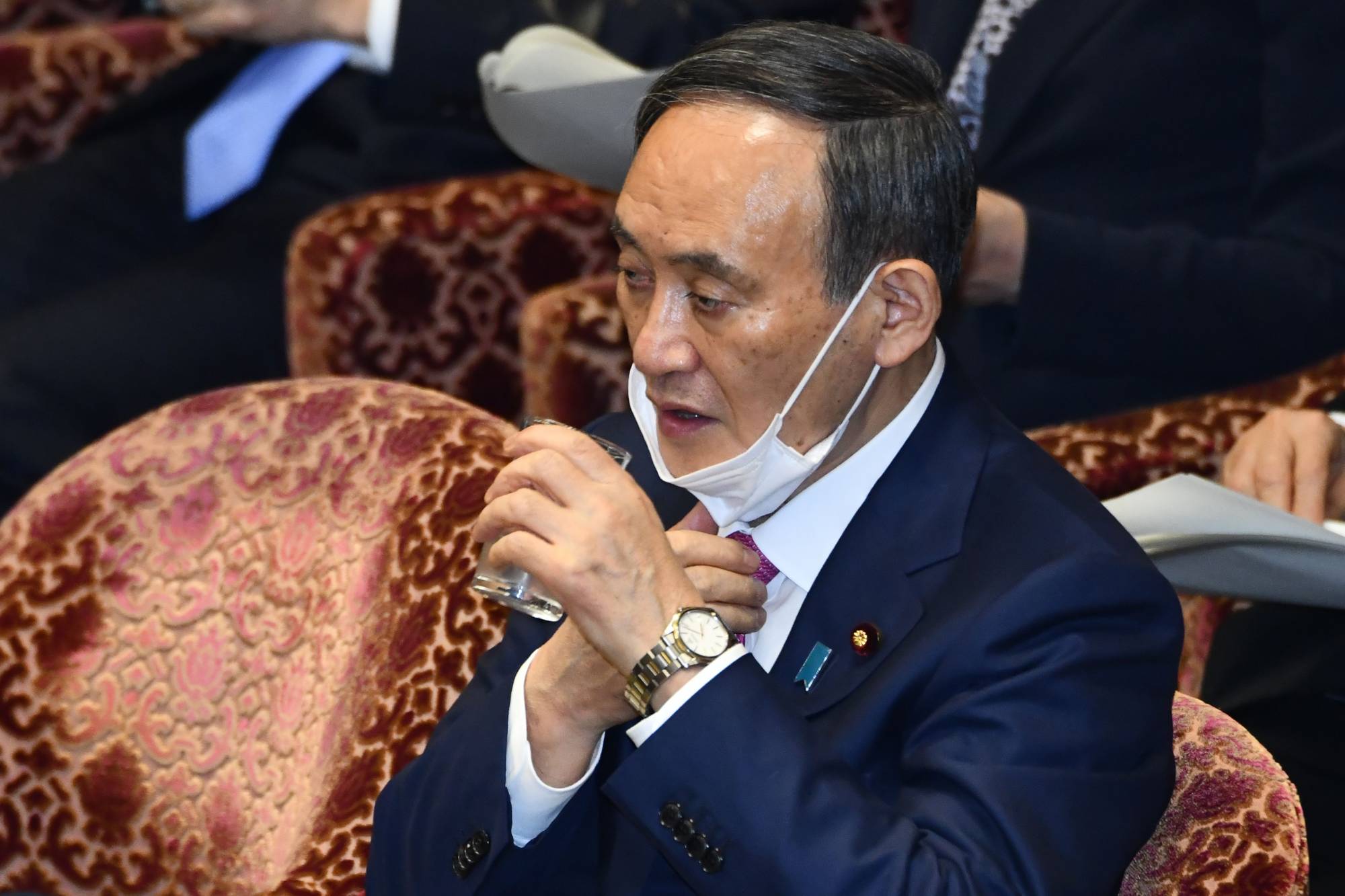 Prime Minister Yoshihide Suga attends a Lower House budget committee session at the Diet in Tokyo on Jan. 22. | AFP-JIJI