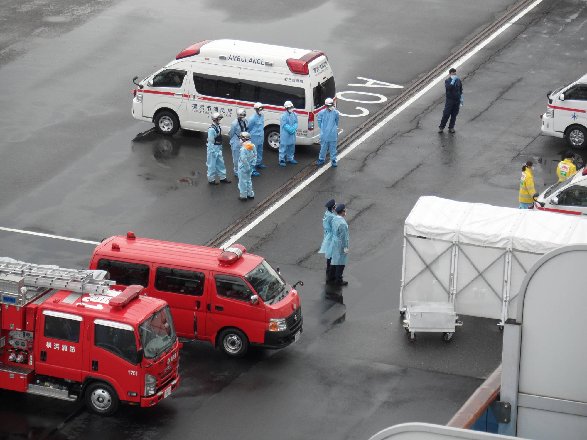 Medical teams wait to evacuate a passenger from the Diamond Princess cruise ship in February. | Courtesy of Alan Sanford 