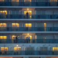 Passengers chat with neighbors on adjoining balconies on the Diamond Princess cruise ship in Yokohama on Feb. 16, 2020. | REUTERS