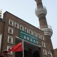 The Chinese national flag is flown outside the mosque at the Xinjiang International Grand Bazar during a government organized trip in Urumqi, in China\'s Xinjiang Uighur Autonomous Region, in January 2019. | REUTERS 