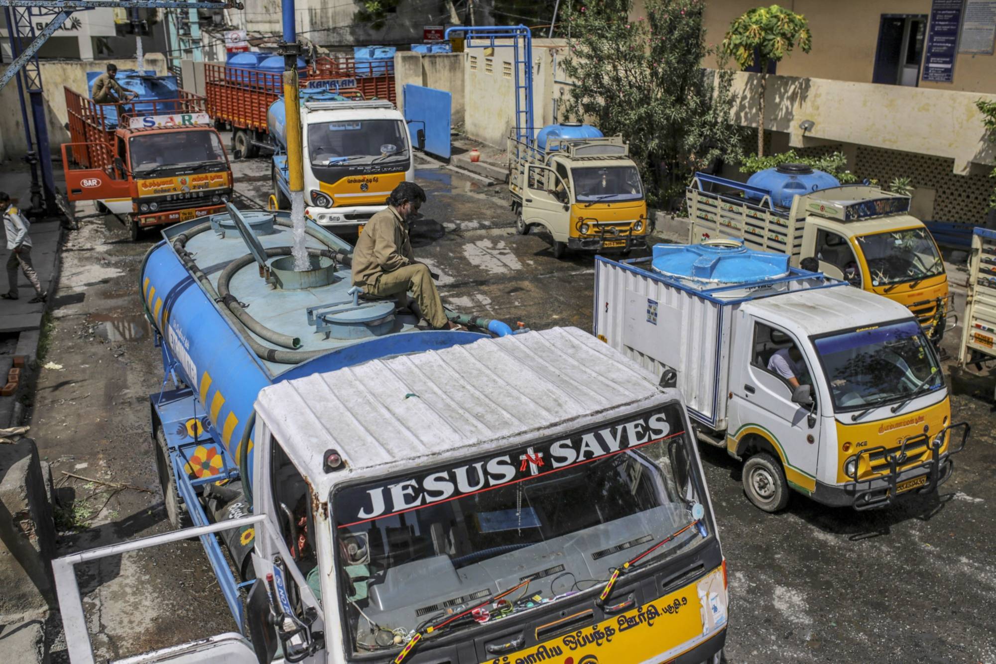 Water tank operators refill vehicles at a government-run station in Chennai on July 4, 2019, after all the city’s main reservoirs ran dry.  | Bloomberg 
