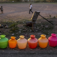 Empty water pots, left to be refilled by a water truck, line a residential street in Chennai, on July 4, 2019. | BLOOMBERG 