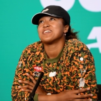 Naomi Osaka speaks during a news conference in Melbourne on Wednesday. | AFP PHOTO / VINCE CALIGIURI / TENNIS AUSTRALIA
