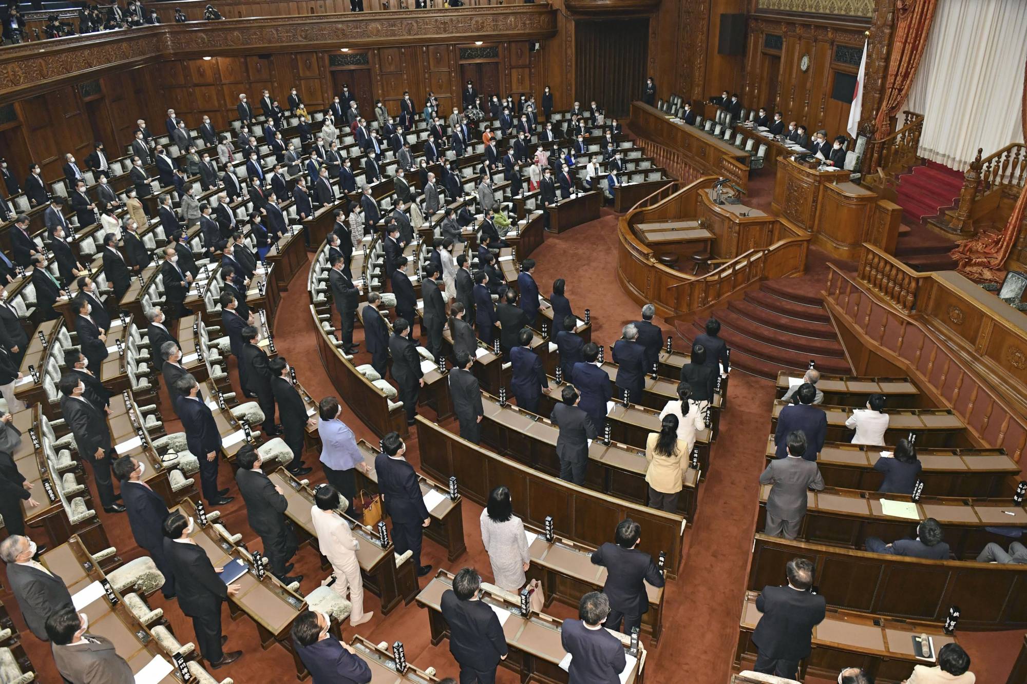 A House of Councilors plenary session passed and enacted revisions to the coronavirus special measures law and the infectious disease law on Wednesday. | KYODO