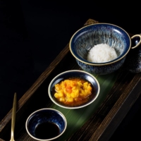 Suzhou style: A golden-orange mixture of roe, milt, tomalley and crabmeat pairs with a small serving of long-grain rice. | COURTESY OF XIE WANG FU
