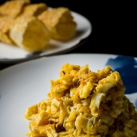 This dish is poppin’: Rich, sauteed crab meat comes served with a sesame-crusted popin cracker. | COURTESY OF XIE WANG FU
