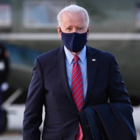 U.S. President Joe Biden makes his way to board Air Force One before departing from Andrews Air Force Base in Maryland on Friday. | AFP-JIJI