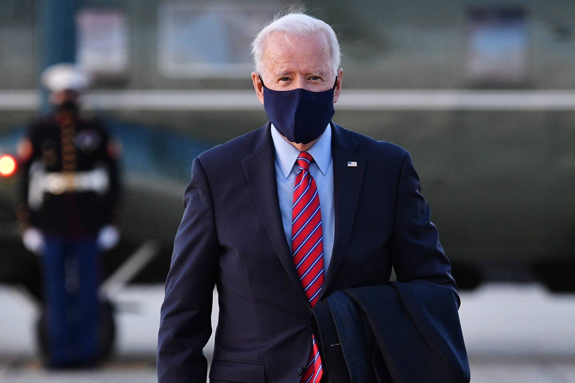 U.S. President Joe Biden makes his way to board Air Force One before departing from Andrews Air Force Base in Maryland on Friday. | AFP-JIJI