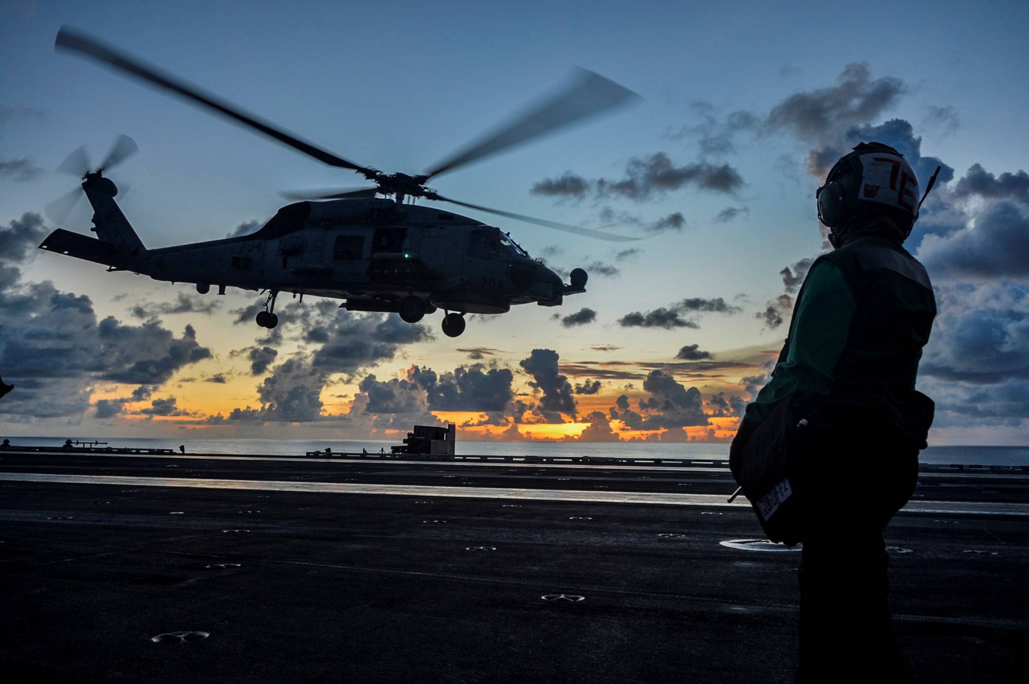 An MH-60R Sea Hawk helicopter launches during flight operations aboard the U.S. Navy aircraft carrier USS Ronald Reagan in the South China Sea in July 2020. | U.S. NAVY / VIA REUTERS