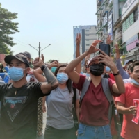 Protesters attend a demonstration against the military coup in Yangon, Myanmar, on Saturday.  | MYANMAR NOW / VIA REUTERS