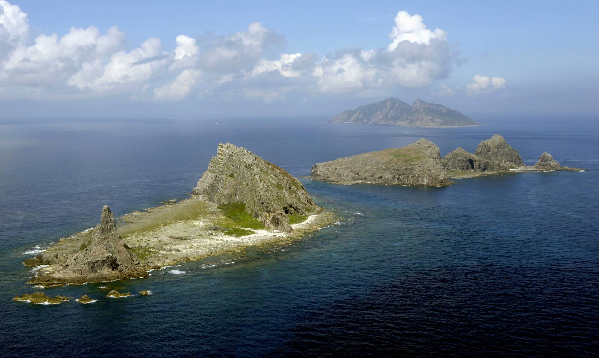 Chinese coast guard vessels entered Japan's territorial waters near the China-claimed Senkaku Islands for the second day in a row on Sunday. | KYODO