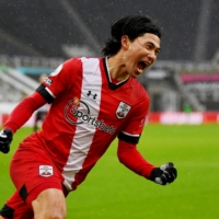 Southampton\'s Takumi Minamino celebrates after scoring the team\'s first goal against Newcastle on Saturday in Newcastle, England. | POOL / VIA REUTERS