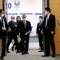 Tokyo 2020 head Yoshiro Mori enters a venue for a news conference in the capital on Thursday. | POOL / VIA REUTERS