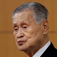 Tokyo 2020 President Yoshiro Mori listens to a question at a news conference in Tokyo on Thursday. | REUTERS