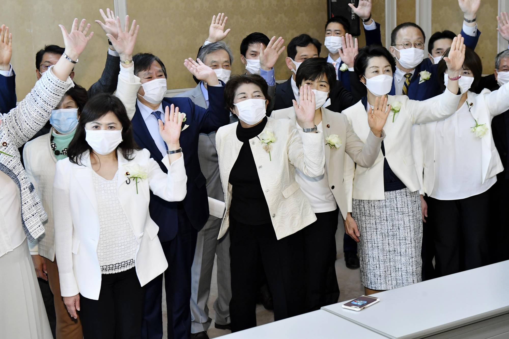 Female opposition lawmakers wear white jackets at the Diet on Tuesday in a show of protest against Tokyo Olympic organizing committee chief Yoshiro Mori's recent sexist comments. | KYODO