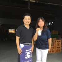 144-year ‘newcomers’: Yoko Nagatomo Shiomi (right) with her husband, Yuichiro Shiomi, hold up a packet of their brewery’s amazake (sweet, low-alcohol sake). | JOAN BAILEY
