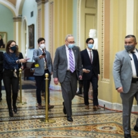 U.S. Senate Majority Leader Chuck Schumer departs the Senate floor Tuesday after the first day of the second impeachment trial of former President Donald Trump. | DOUG MILLS / THE NEW YORK TIMES