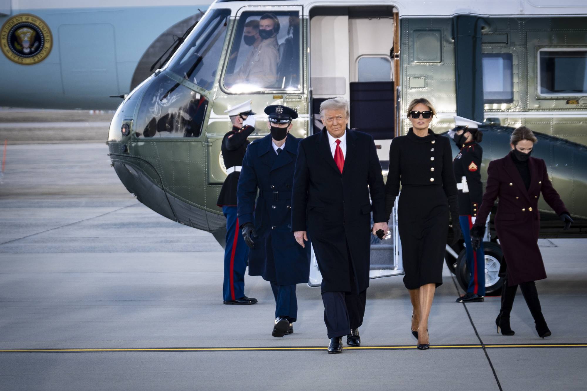 U.S. President Donald Trump, accompanied by first lady Melania Trump, on Jan. 20 | Pete Marovich / The New York Times