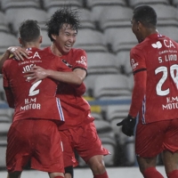 Gil Vicente midfielder Kanya Fujimoto (center) celebrates with teammates after scoring against Sporting on Tuesday in Barcelos, Portugal. | AFP-JIJI