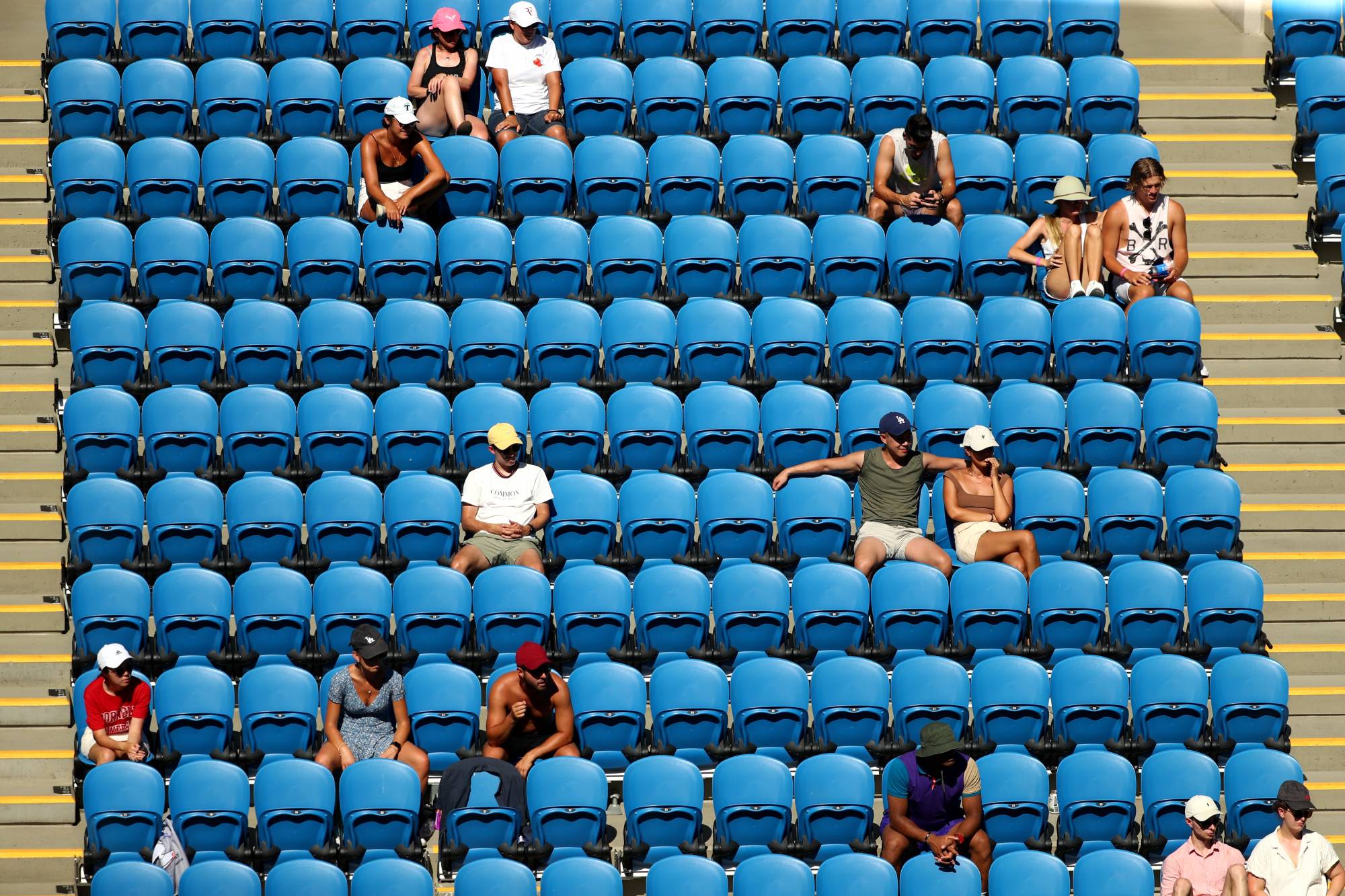 Attendance has been sparse in the opening days of the Australian Open after the appearance of a highly infectious coronavirus strain rattled Australian fans. | Reuters