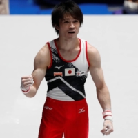Japan\'s Kohei Uchimura reacts after performing on the horizontal bar at the Friendship and Solidarity Competition in Tokyo on Nov. 8. | REUTERS